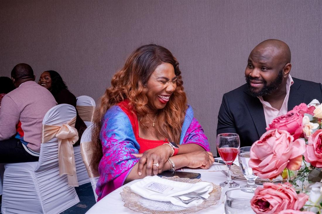 Guests laughing at their table